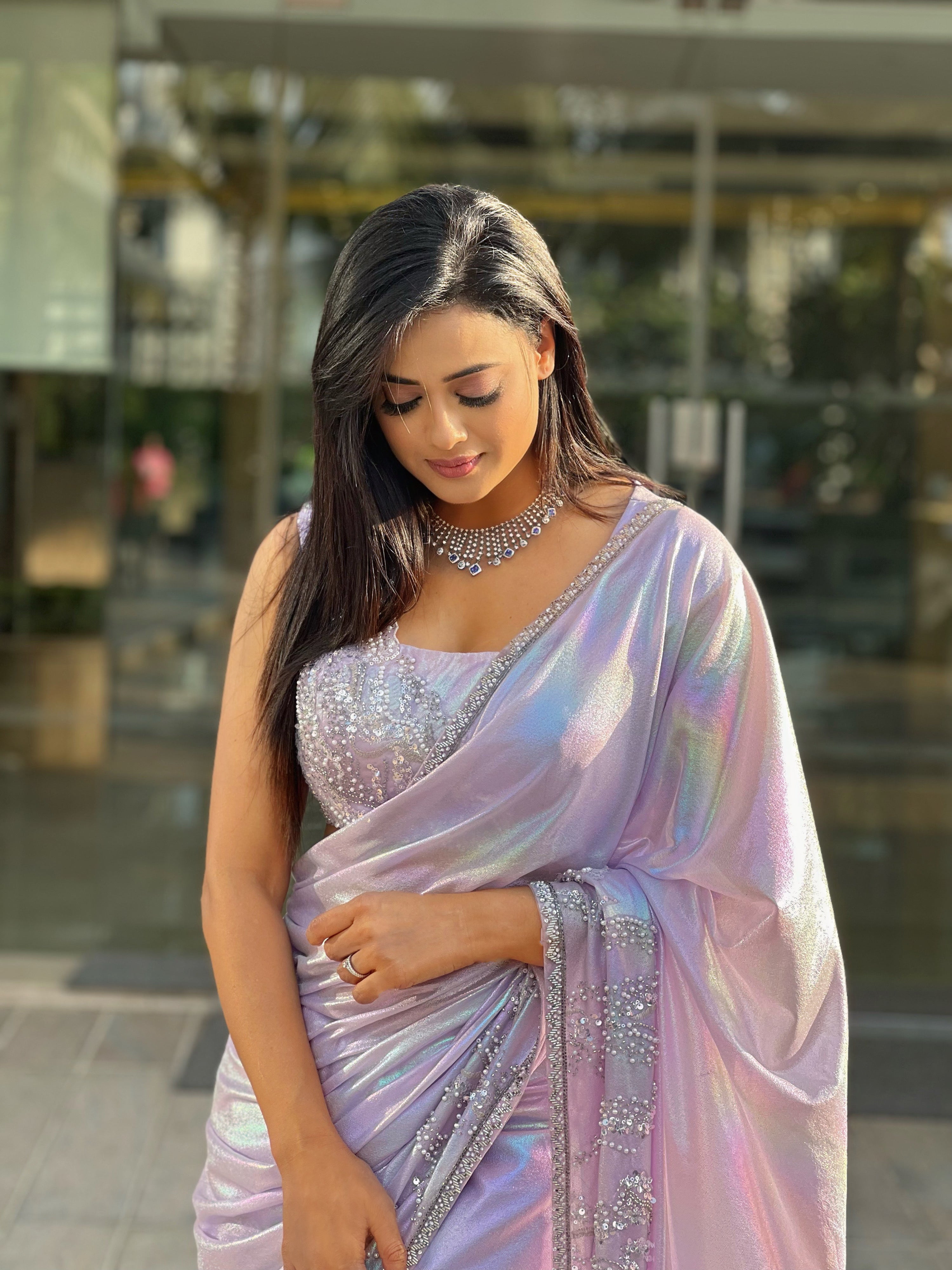 Shweta Tiwari in our Lilac hand embroidered sequence and peal work saree set